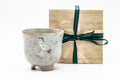 Japanese Matcha Bowl - Standing Crane Grey Pink Gohonte Glazed Winter Chawan with Tomobako Wooden Box - 450ml - the chawan beside its cord-tied wooden tomobako box