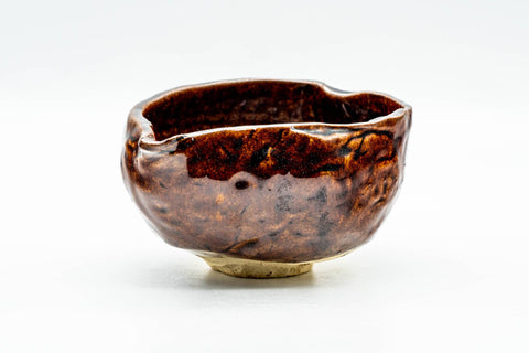 Front view of the katakuchi showing its wide mouth and pinched spout from another angle