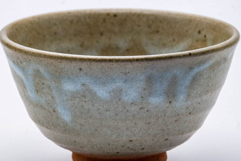 Front view of the chawan highlighting the mottled beige-and-grey glaze.