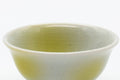 Tezumi — Japanese Teacup - Small Yellow White Porcelain Guinomi - 40ml — tipped to show the interior