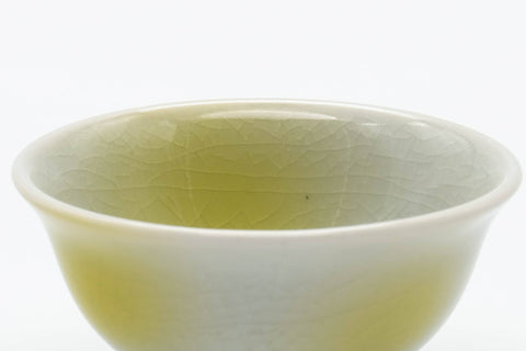 Tezumi — Japanese Teacup - Small Yellow White Porcelain Guinomi - 40ml — tipped to show the interior