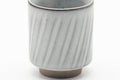 Tezumi — Japanese Teacup - Spiraling White Grey Glazed Yunomi - 130ml — tipped to show the interior