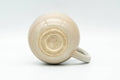 Tezumi — Japanese Teacup - Small Beige and White Hagi-yaki Ushirode Yunomi - 90ml — top-down view of the interior