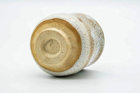 Underside of the teacup, showing the unglazed foot ring.