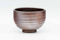 Front view of the Bizen chawan, warm brown shading to ash grey