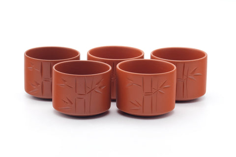 Tezumi — Japanese Tea Set - Bamboo Engraved Tokoname-yaki Kyusu Teapot with 5 Yunomi Teacups — closeup of a single piece
