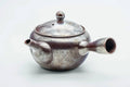 Side view of the large banko kyusu with the handle to the left, lid on.