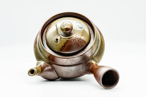Overhead view into the open teapot with the lid removed, showing the interior.