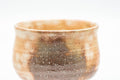 Tezumi — Japanese Teacups - Pair of Beige Brown Gohonte Hagi-yaki Yunomi - 180ml — tipped to show the interior