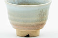 Three-quarter view showing the rim and weathered glaze.