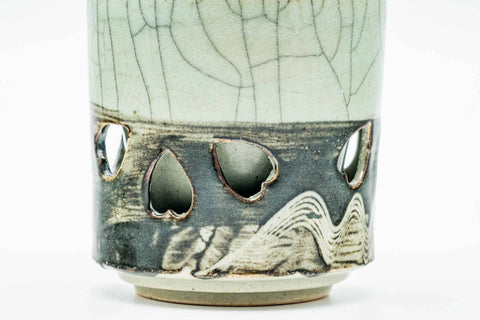 Three-quarter view showing the decorative horse band around the lower body.