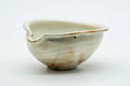 Beige Shigaraki-yaki katakuchi water cooler with a pouring spout and orange-brown kiln blush, front three-quarter view.