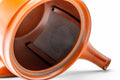 Interior view with the lid removed, revealing the built-in mesh strainer at the base of the spout.