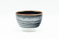 Japanese Teacup - Wavy Tenmoku Glazed Guinomi - 50ml - front view of the black tenmoku-glazed cup