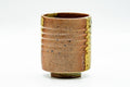 Front view showing the horizontal ribbing and natural ash colouring.