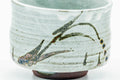 Front view emphasising the horizontal throwing lines and the grass-like drip.