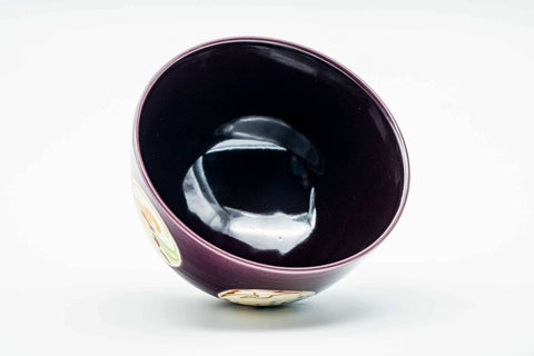 Three-quarter view looking into the bowl, showing the dark purple glazed interior.