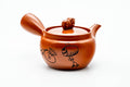 Japanese Kyusu - Sheep Drum Decorated Tokoname-yaki Mesh Teapot - 260ml - three-quarter view of the red shudei body with engraved decoration, lid on and side handle to the right