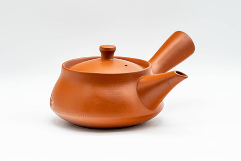Japanese Tea Set - Long Grass Engraved Tokoname-yaki Debeso Kyusu Teapot with 5 Yunomi Teacups - three-quarter view of the teapot showing the handle and spout