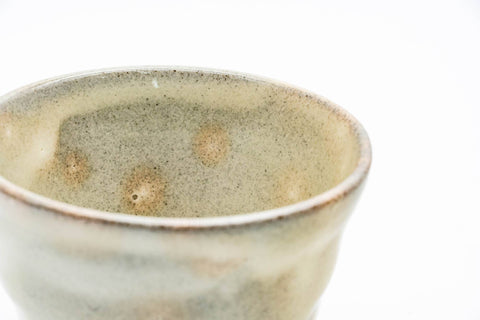 Gohonte Rokurome Mino-yaki yunomi teacup, speckled beige glaze with throwing rings - closeup of the glazed interior with gohonte speckles