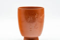 Japanese Teacups - Pair of Smooth Red Shudei Tokoname-yaki Meoto Yunomi with Wooden Box - three-quarter view of a single cup showing the engraving