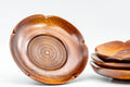 Tezumi — Japanese Chataku - Set of 4 Flower Petal-Shaped Wooden Tea Saucers — three-quarter view