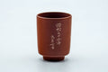 Tezumi — Japanese Teacup - Engraved Calligraphy Red Shudei Tokoname-yaki Yunomi - 120ml — front view from another angle
