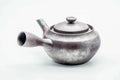 Side view of the large kyusu with the handle to the left, lid on.