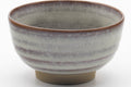 Tezumi — Japanese Teacup - Grey Milky Glazed Spiraling Yunomi - 130ml — tipped to show the interior