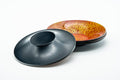Japanese Chataku - Set of 3 Abstract Kara-nuri Red Lacquered Tea Saucers - the saucers showing the black lacquer undersides alongside the mottled tops