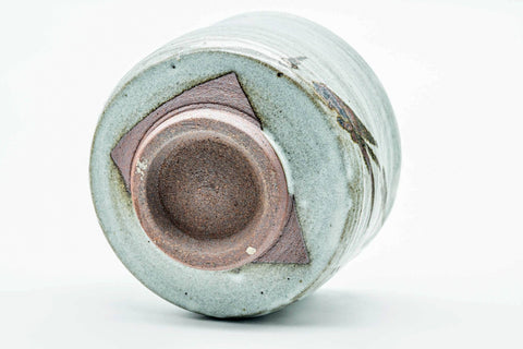 Three-quarter overhead view showing the interior well and exposed clay foot.