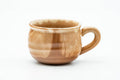 Handled teacup alone, front view, showing the C-shaped handle and ribbed body.