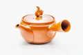 Red shudei Tokoname kyusu, side profile with the spout to the left