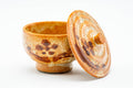 Lidded yunomi in orange Shino glaze with reddish floral spots, shown with its lid set beside the cup.
