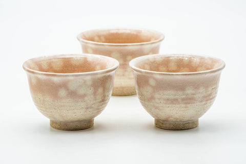 The three cups viewed from another angle, showing the soft pink spotting.