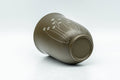 Japanese Teacup - Floral Green Ryokudei Tokoname-yaki Yunomi - 130ml - cup tilted showing the green clay body and floral motif