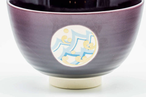 Front view showing another medallion against the glossy purple glaze.