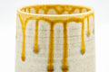 Japanese Teacup - Beige Yellow Drip-Glazed Yunomi - close-up of the yellow drip glaze