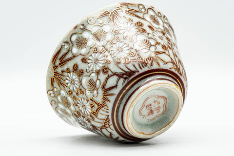 Japanese Teacup - Chrysanthemum Ume Kutani-yaki Yunomi - 120ml - tilted view showing the patterned exterior and base