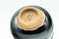 Japanese Teacup - Jet Black Beige Drip-Glazed Guinomi - 40ml - bottom view of the unglazed footring