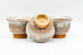 Japanese Teacups - Set of 3 Beige Drip-Glazed Gohonte Hagi-yaki Yunomi - 100ml - overhead view with one cup showing the interior and foot