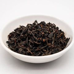 Hayashi - Organic Benifuuki Wakoucha - angled view of the dry black tea leaves in a white dish
