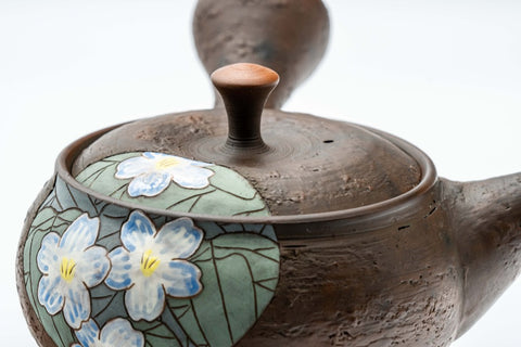 Overhead view of the teapot showing the lid and the floral decoration.