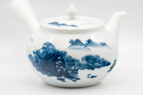 Japanese Tea Set - Hataman Toen Arita-yaki Porcelain Debeso Kyusu with 3 Wan-nari Yunomi - 420ml - three-quarter view of the teapot showing the blue and white village scene