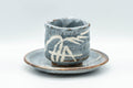 Japanese Teacup - Bamboo Suana Shino Glazed Tsutsu-gata Yunomi with Coaster - front view of the light-blue shino-glazed cup resting on its matching coaster