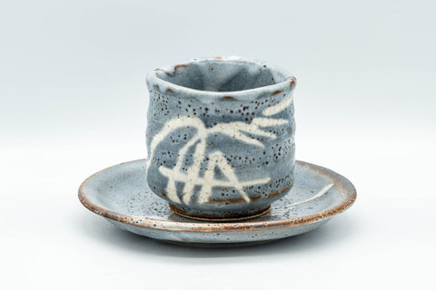 Japanese Teacup - Bamboo Suana Shino Glazed Tsutsu-gata Yunomi with Coaster - front view of the light-blue shino-glazed cup resting on its matching coaster