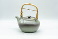 Japanese Tea Set - Green Arita-yaki Debeso Dobin Teapot with 2 Lidded Yunomi Teacups - front view of the dobin teapot with its bamboo top handle