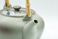Japanese Tea Set - Green Arita-yaki Debeso Dobin Teapot with 2 Lidded Yunomi Teacups - teapot with the lid off showing the interior
