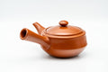Tezumi — Japanese Kyusu - Engraved Red Shudei Tokoname-yaki Debeso Teapot - 210ml — side view showing the spout