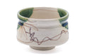 Tezumi — Japanese Matcha Bowl - Floral Beige Green Glazed Oribe-yaki Chawan - 250ml — closeup of the glaze
